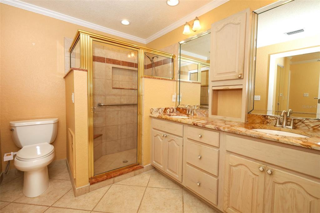 102 Pineview Court Altamonte Springs, FL 32714 - Photo 25 of 59 a bathroom with a granite countertop sink toilet and shower