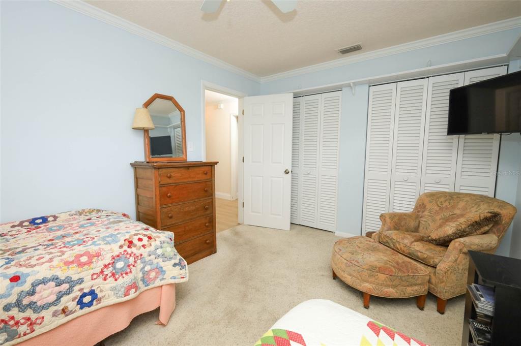 102 Pineview Court Altamonte Springs, FL 32714 - Photo 29 of 59 a bedroom with a bed and couch