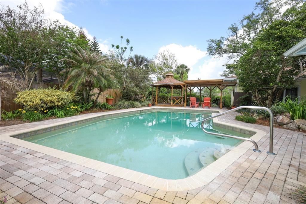 102 Pineview Court Altamonte Springs, FL 32714 - Photo 38 of 59 a view of a swimming pool with a lounge chair