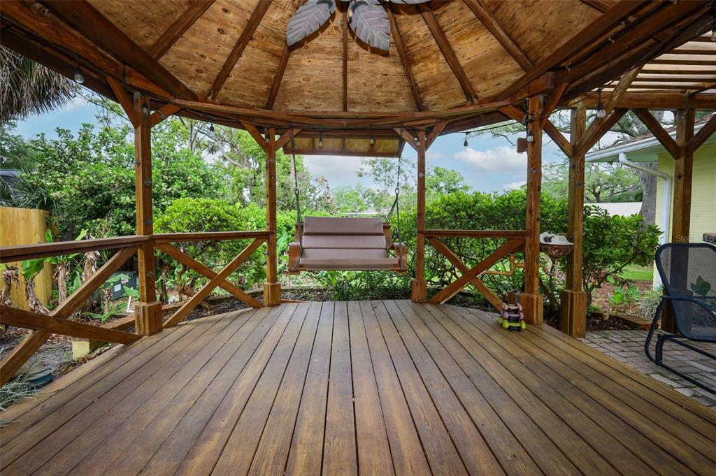 102 Pineview Court Altamonte Springs, FL 32714 - Photo 44 of 59 a view of deck with wooden floor and outdoor seating