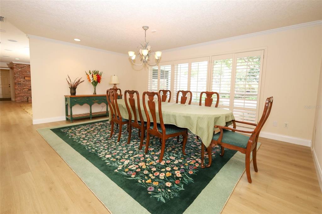 102 Pineview Court Altamonte Springs, FL 32714 - Photo 7 of 59 a view of a dining room with furniture window and wooden floor