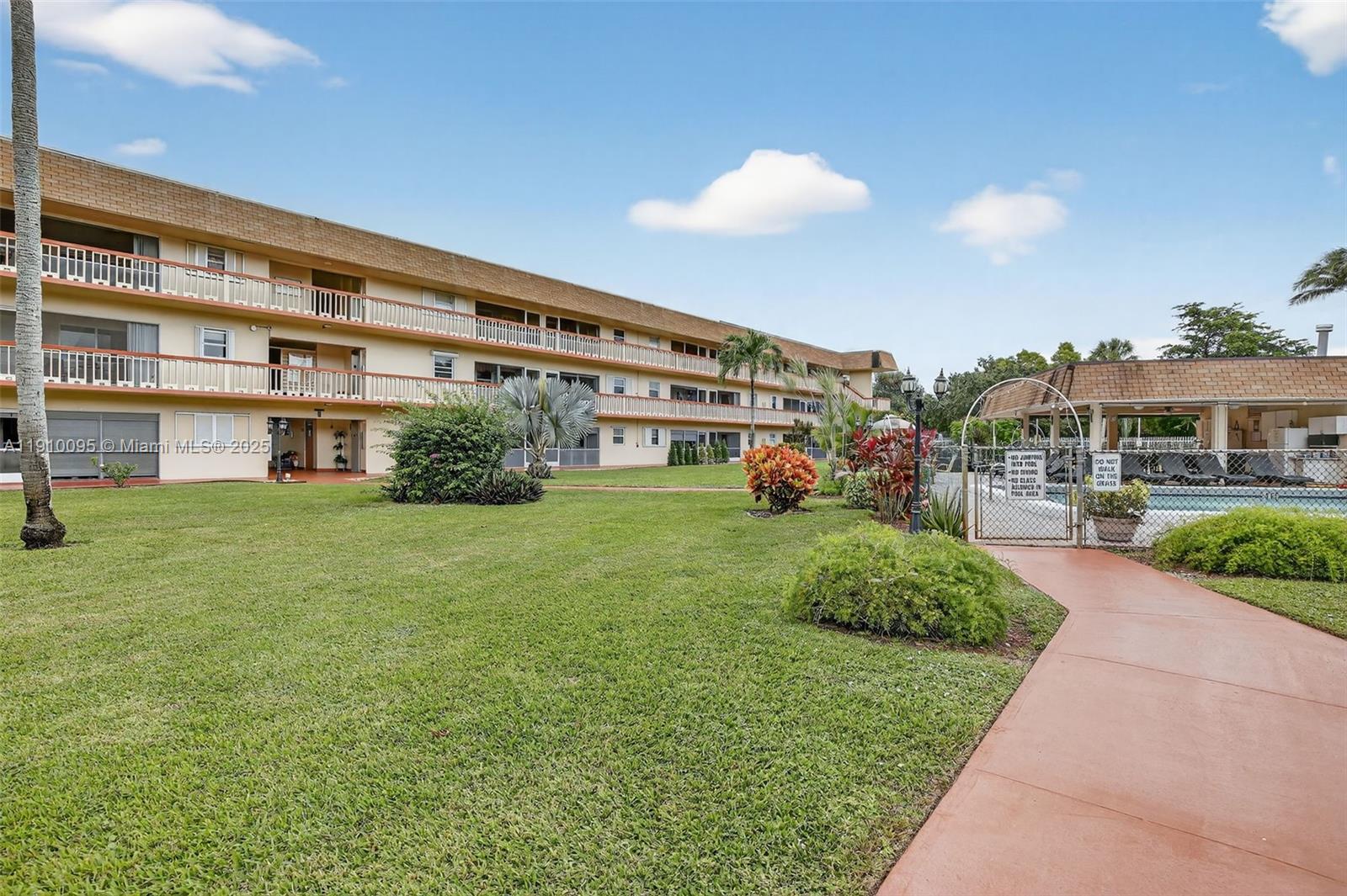 a front view of a building with garden