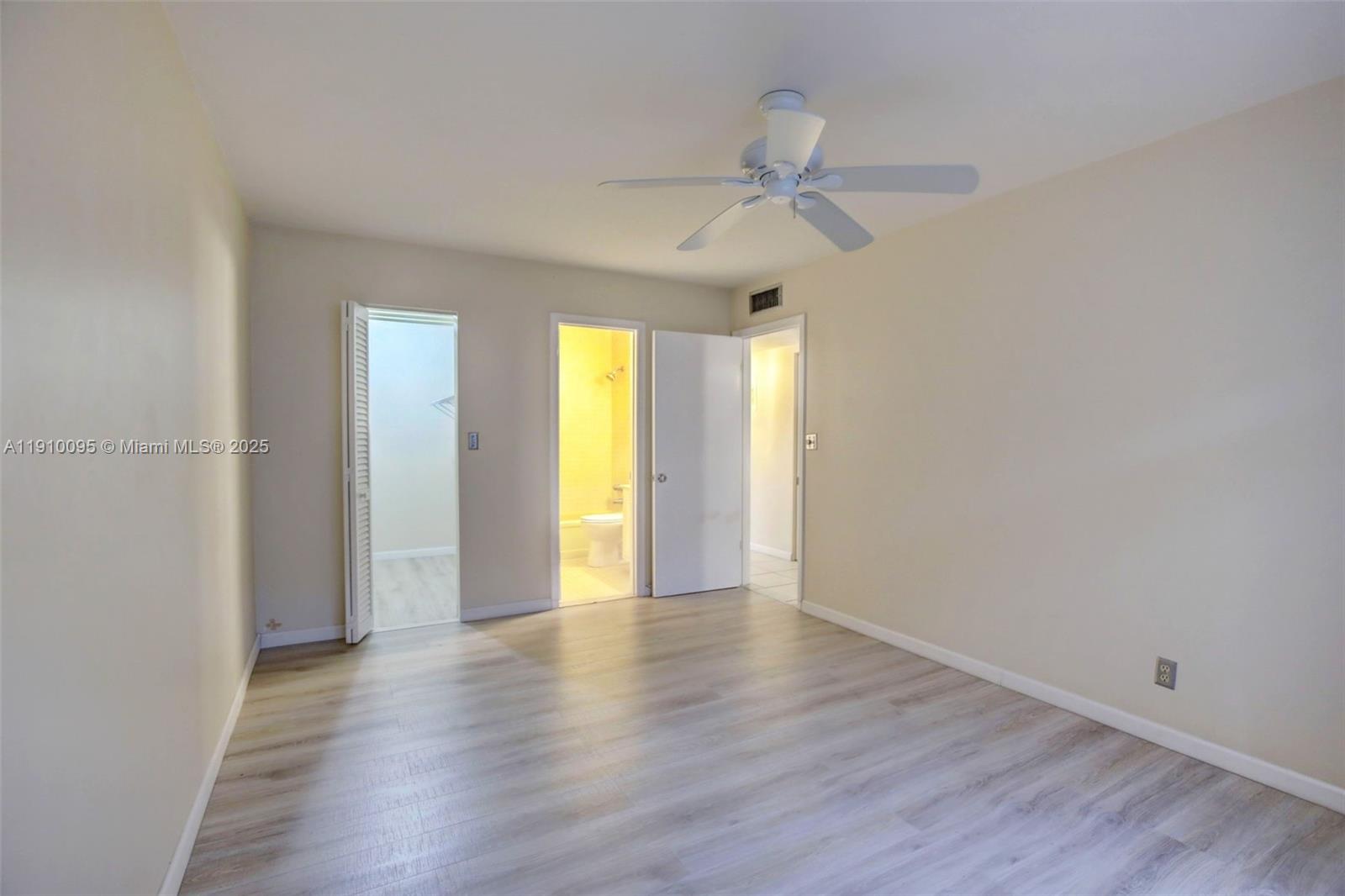 5300 Washington Street, Unit T218 Hollywood, FL 33021 - Photo 19 of 36 a view of an empty room with wooden floor and window