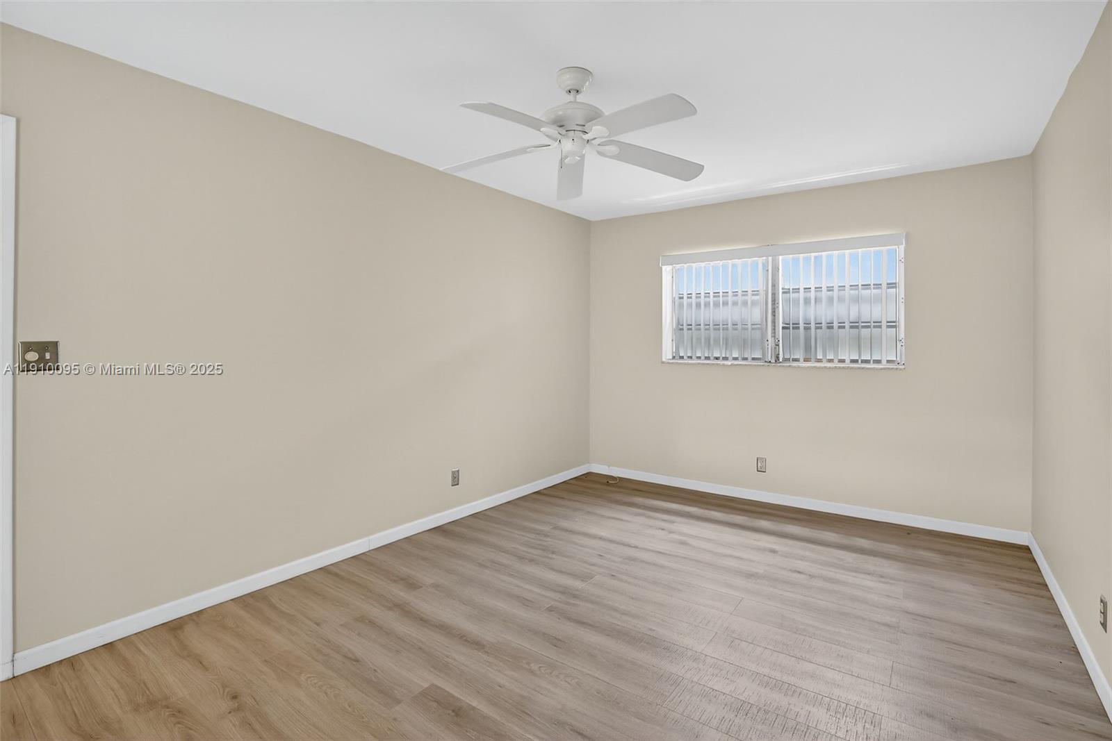 5300 Washington Street, Unit T218 Hollywood, FL 33021 - Photo 20 of 36 wooden floor in an empty room with a window