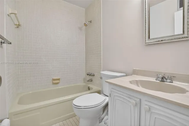 a view of a room with wooden floor and windows