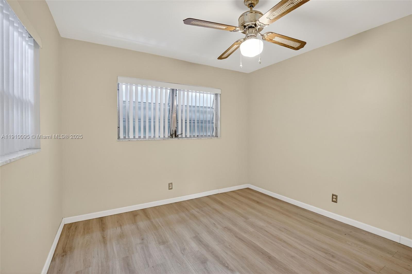 5300 Washington Street, Unit T218 Hollywood, FL 33021 - Photo 26 of 36 an empty room with a window and a fan