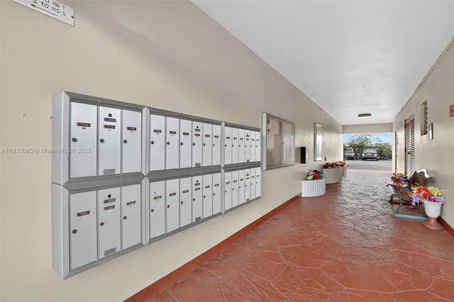 a view of swimming pool with outdoor seating and a potted plant