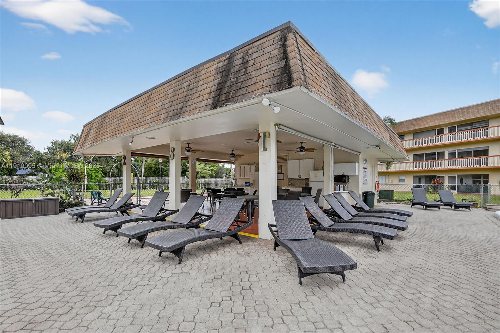 5300 Washington Street, Unit T218 Hollywood, FL 33021 - Photo 30 of 36 a building outdoor space with patio furniture and garden