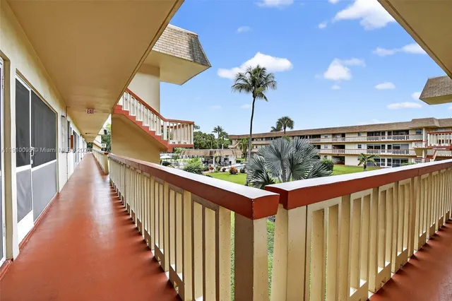 a view of cars parked in front of a building