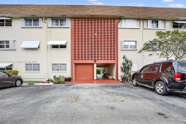 a view of a building with a yard