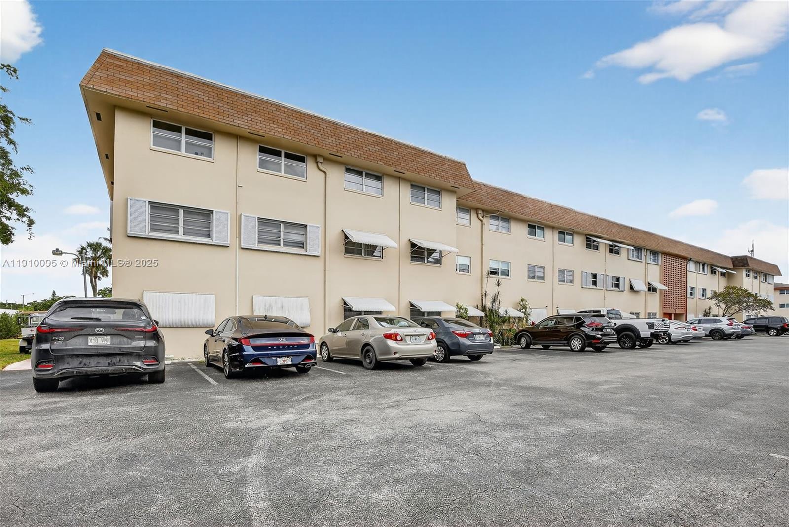 5300 Washington Street, Unit T218 Hollywood, FL 33021 - Photo 33 of 36 a view of cars parked in front of a building