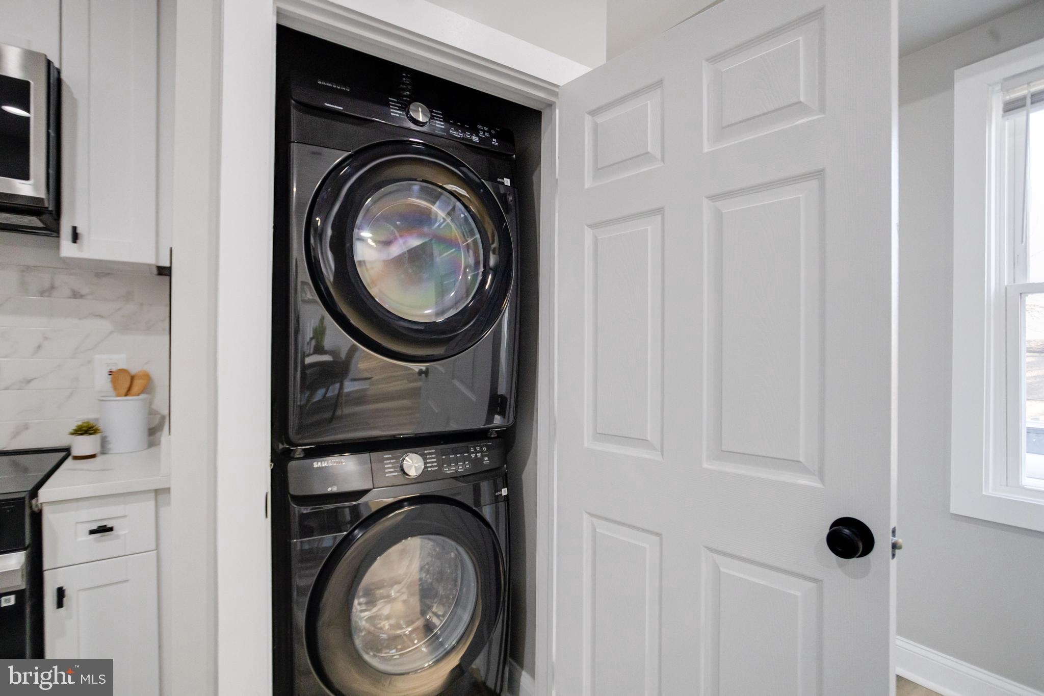 1534 Homestead Street Baltimore, MD 21218 - Photo 12 of 48 a view of a storage and utility room with washer and dryer