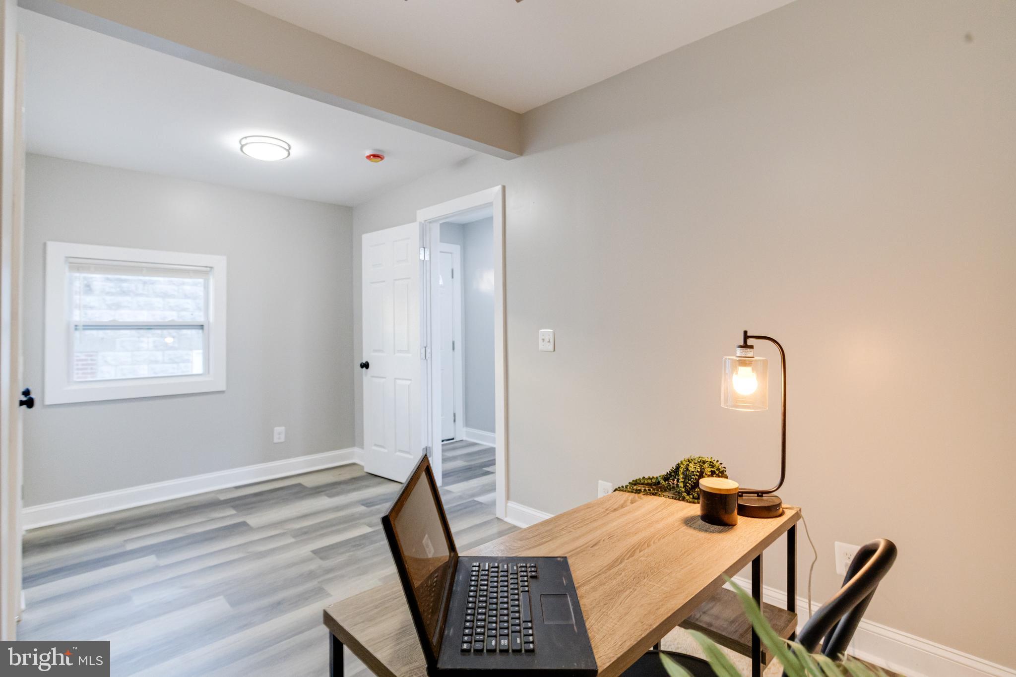 1534 Homestead Street Baltimore, MD 21218 - Photo 18 of 48 a dining room with furniture and wooden floor