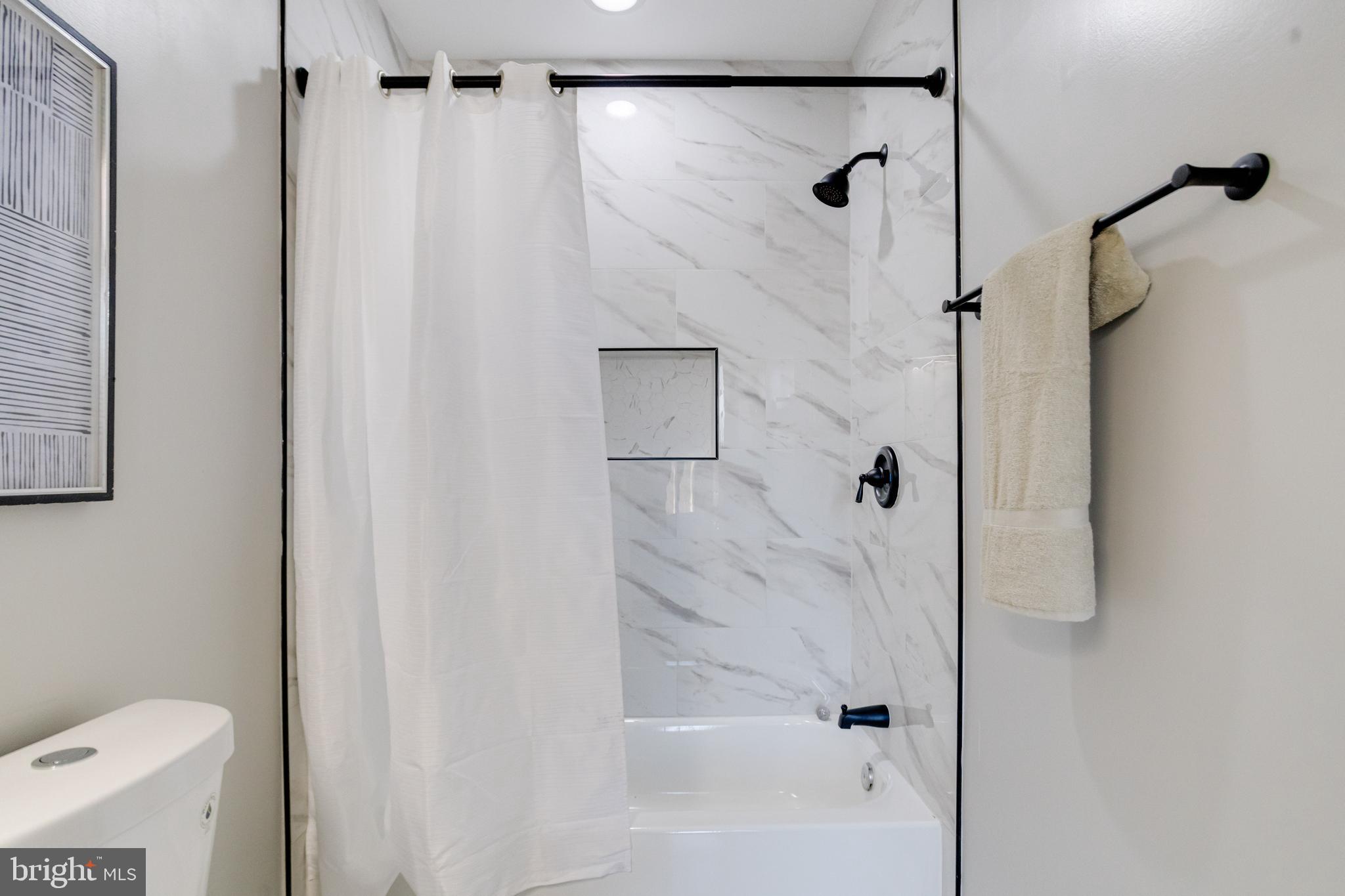 1534 Homestead Street Baltimore, MD 21218 - Photo 21 of 48 a bathroom with a shower and a toilet