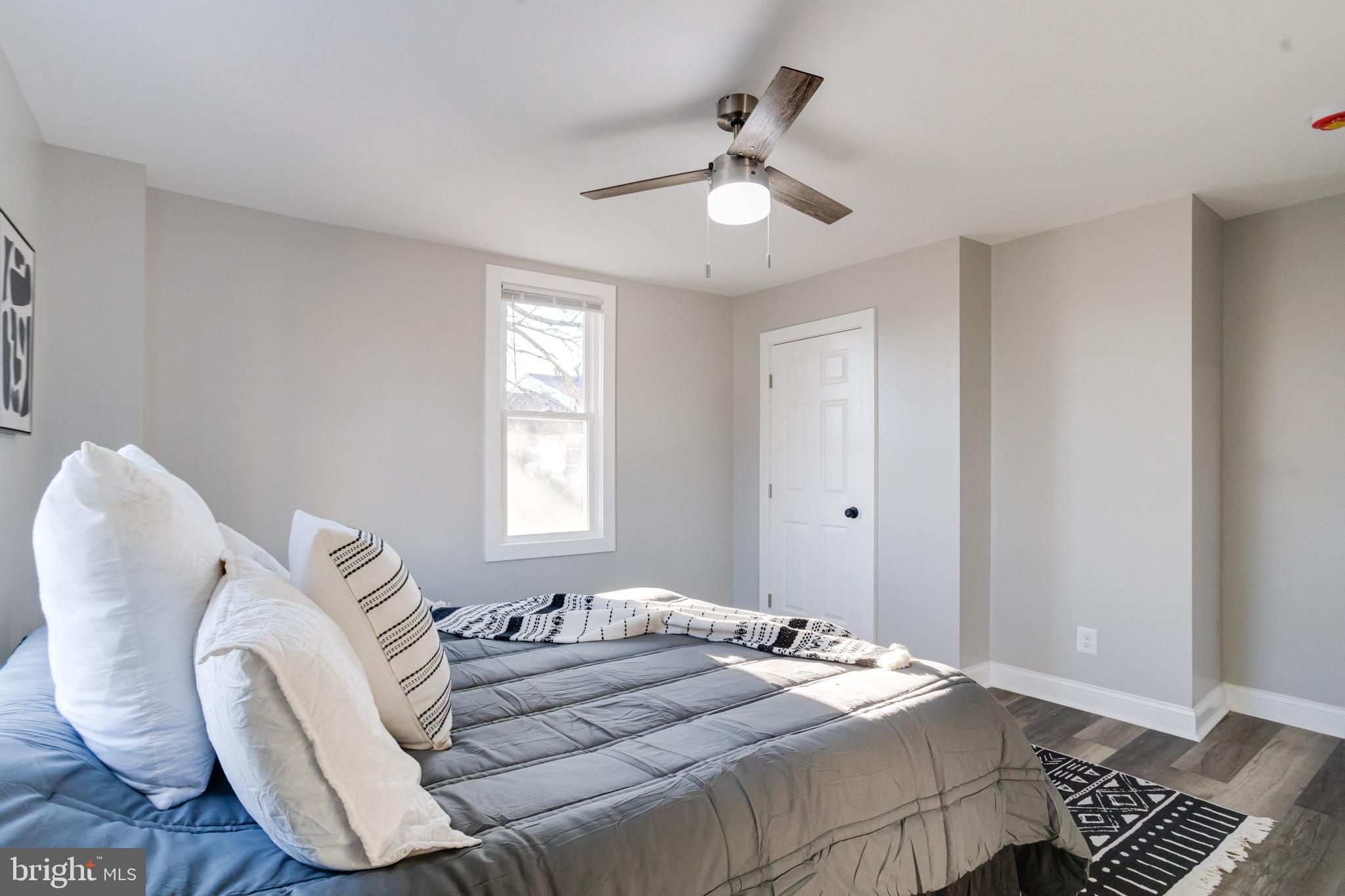 1534 Homestead Street Baltimore, MD 21218 - Photo 25 of 48 a bedroom with bed and window