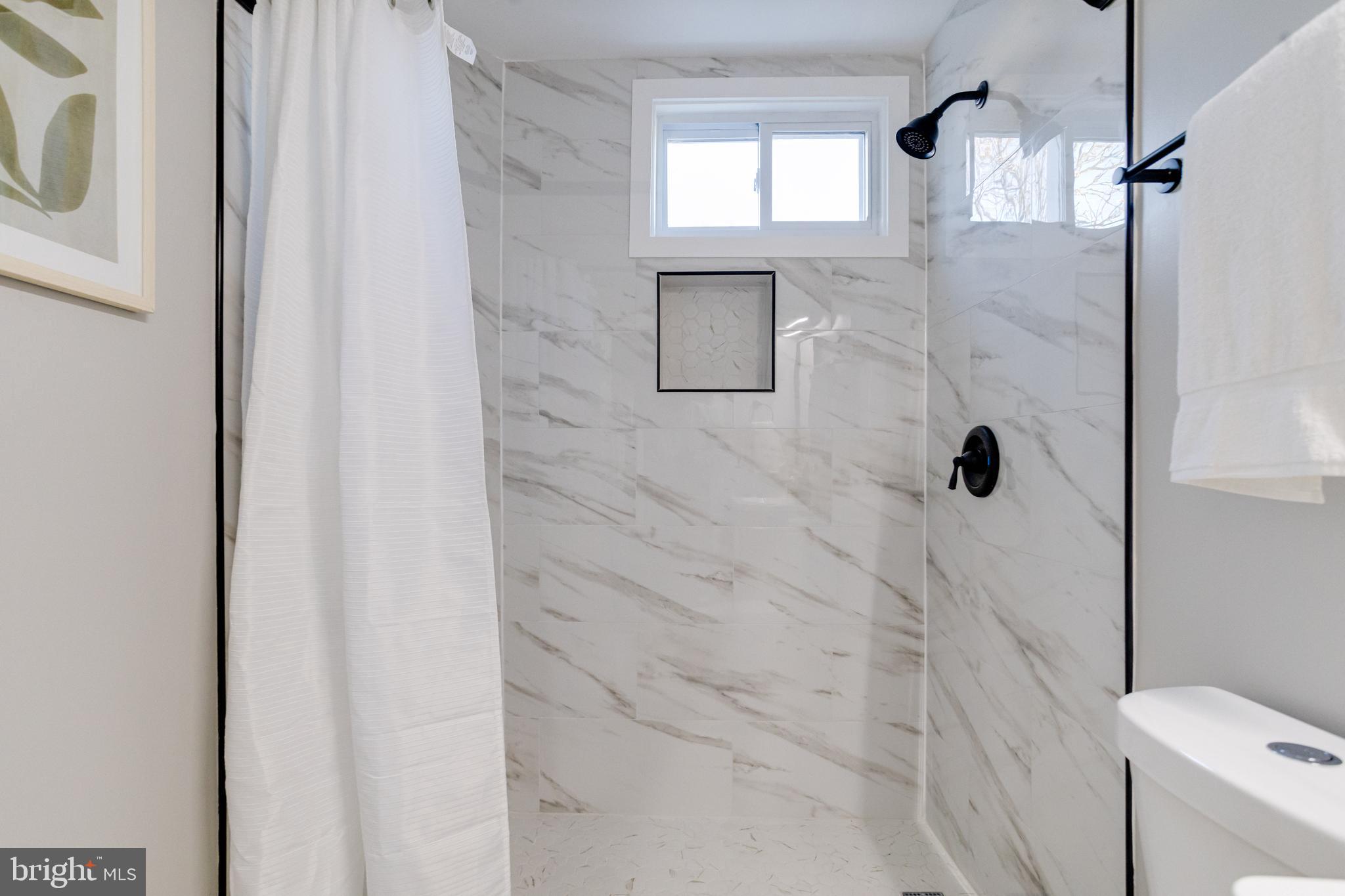 1534 Homestead Street Baltimore, MD 21218 - Photo 30 of 48 a bathroom with a shower and toilet