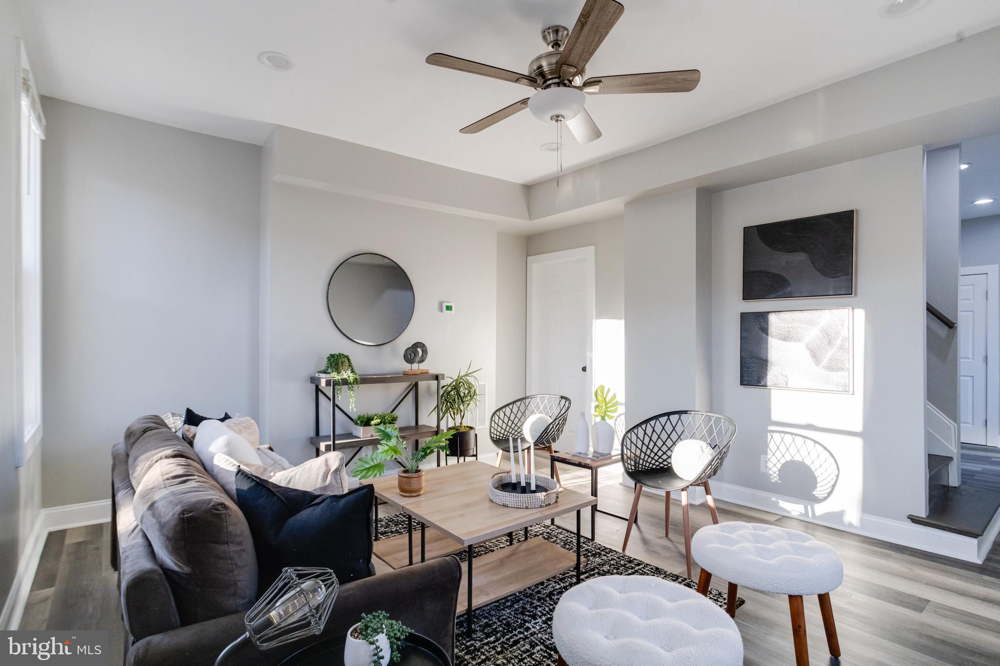 1534 Homestead Street Baltimore, MD 21218 - Photo 3 of 48 a living room with furniture a flat screen tv and a window