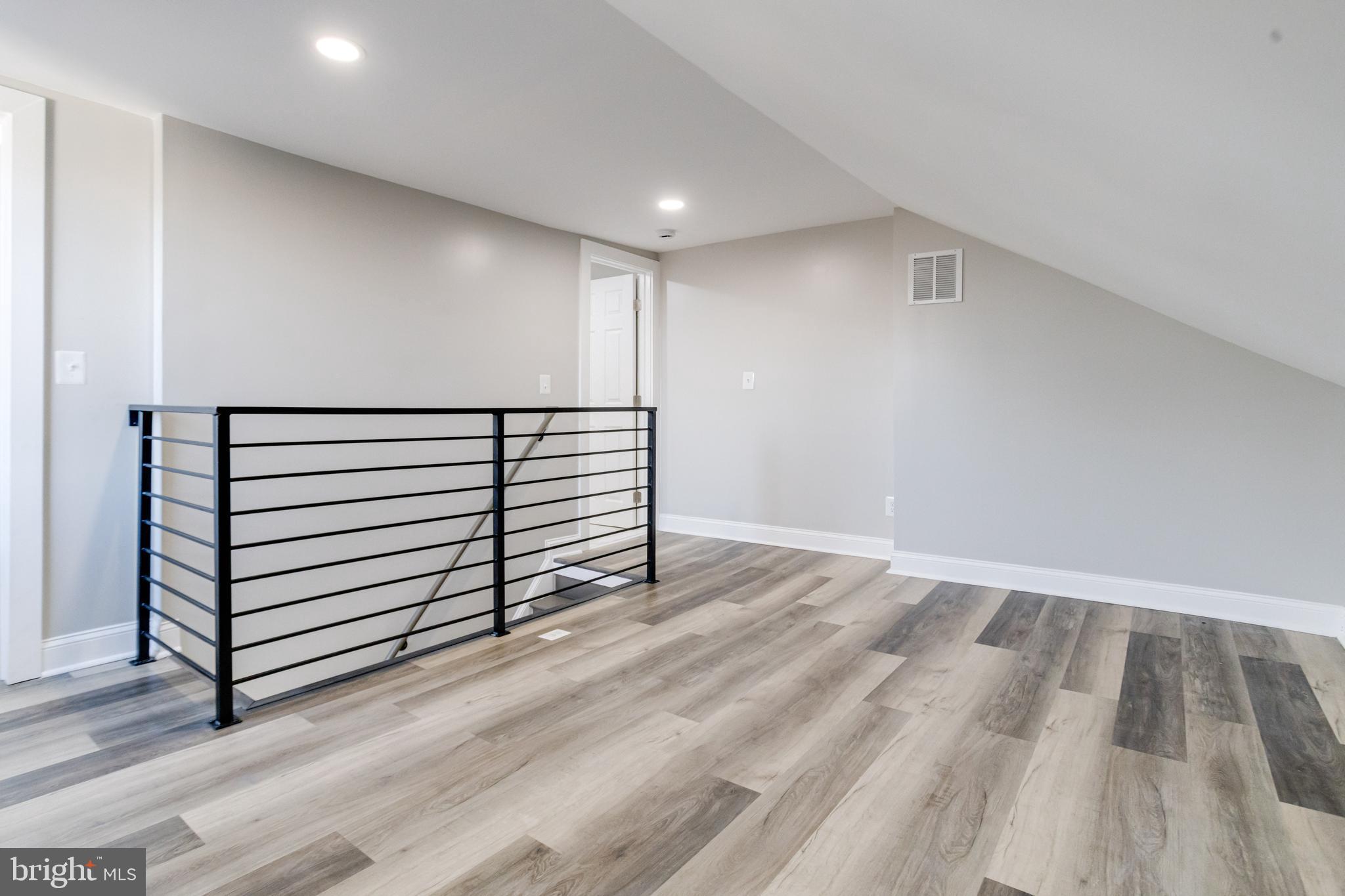 1534 Homestead Street Baltimore, MD 21218 - Photo 38 of 48 a view of a room with wooden floor