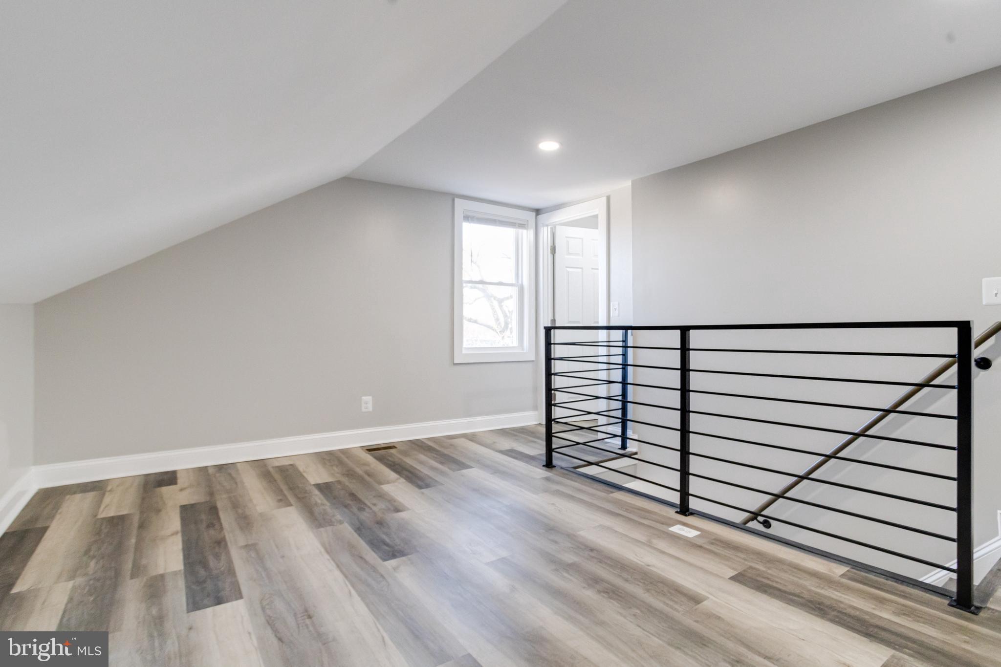 1534 Homestead Street Baltimore, MD 21218 - Photo 40 of 48 a view of a room with stairs and a window