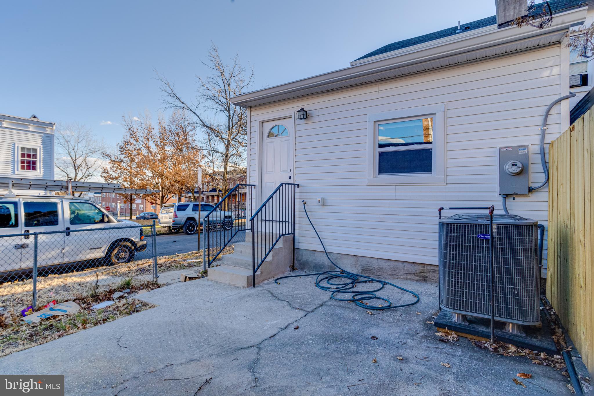 1534 Homestead Street Baltimore, MD 21218 - Photo 44 of 48 a backyard of a house with barbeque oven table and chairs