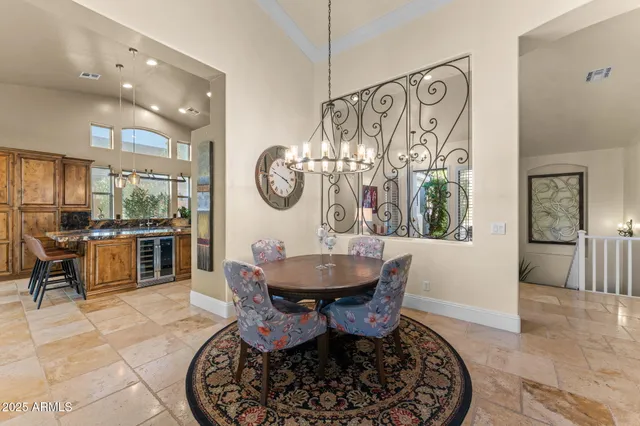 a living room with furniture potted plant and a large window