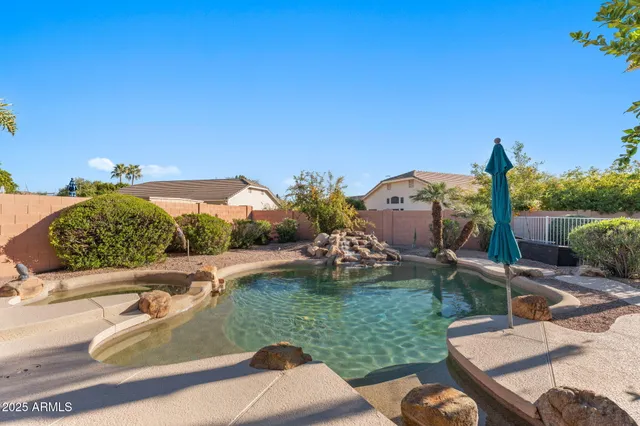 a view of a swimming pool with a patio