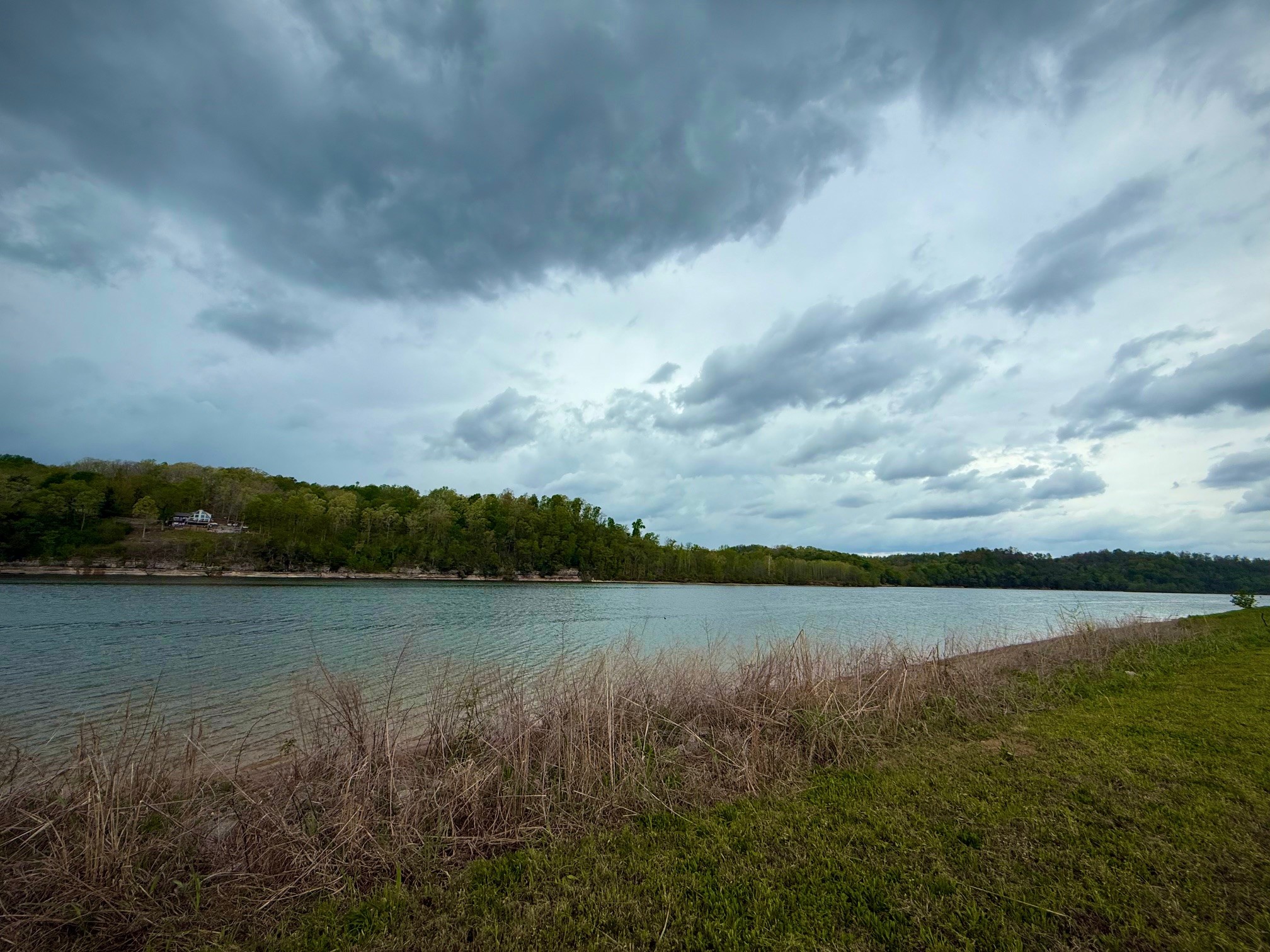 2227 Hardin Bottom River Road Clifton, TN 38425 - Photo 1 of 9 a view of a lake with houses in the back