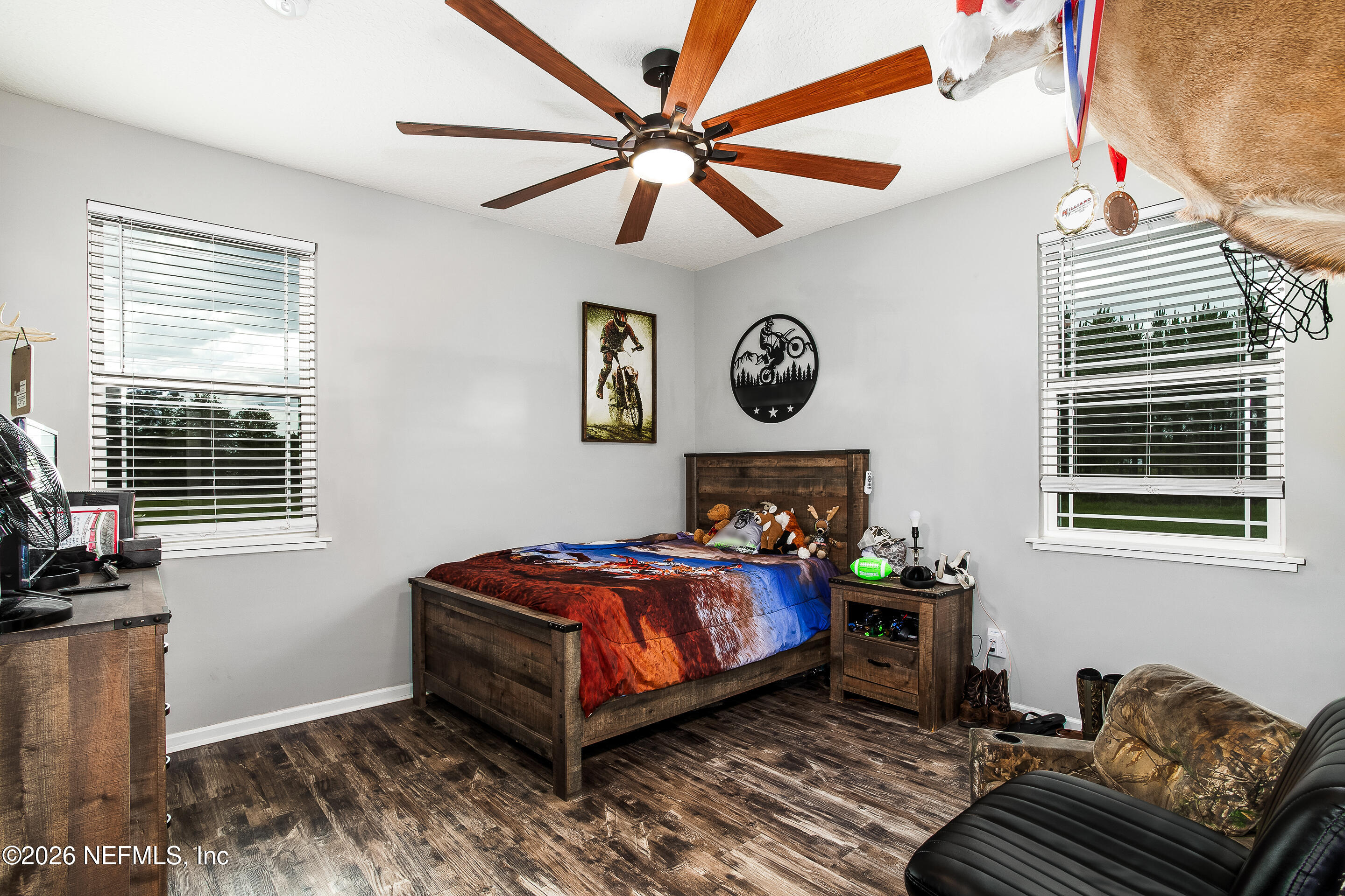26575 Sheared Stokes Road Hilliard, FL 32046 - Photo 10 of 39 a bedroom with a bed and a window