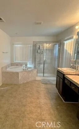 a view of large kitchen with granite countertop a sink and a stove
