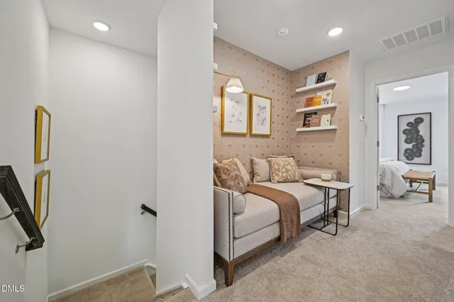 a spacious bedroom with a bed and a cabinets