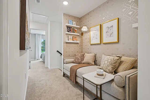 a bedroom with a bed and painting on the wall