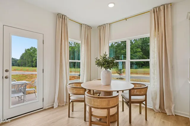 a kitchen with a sink cabinets and wooden floor