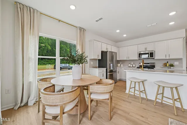a kitchen with a refrigerator and a sink