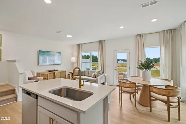 a room with a dresser and mirror