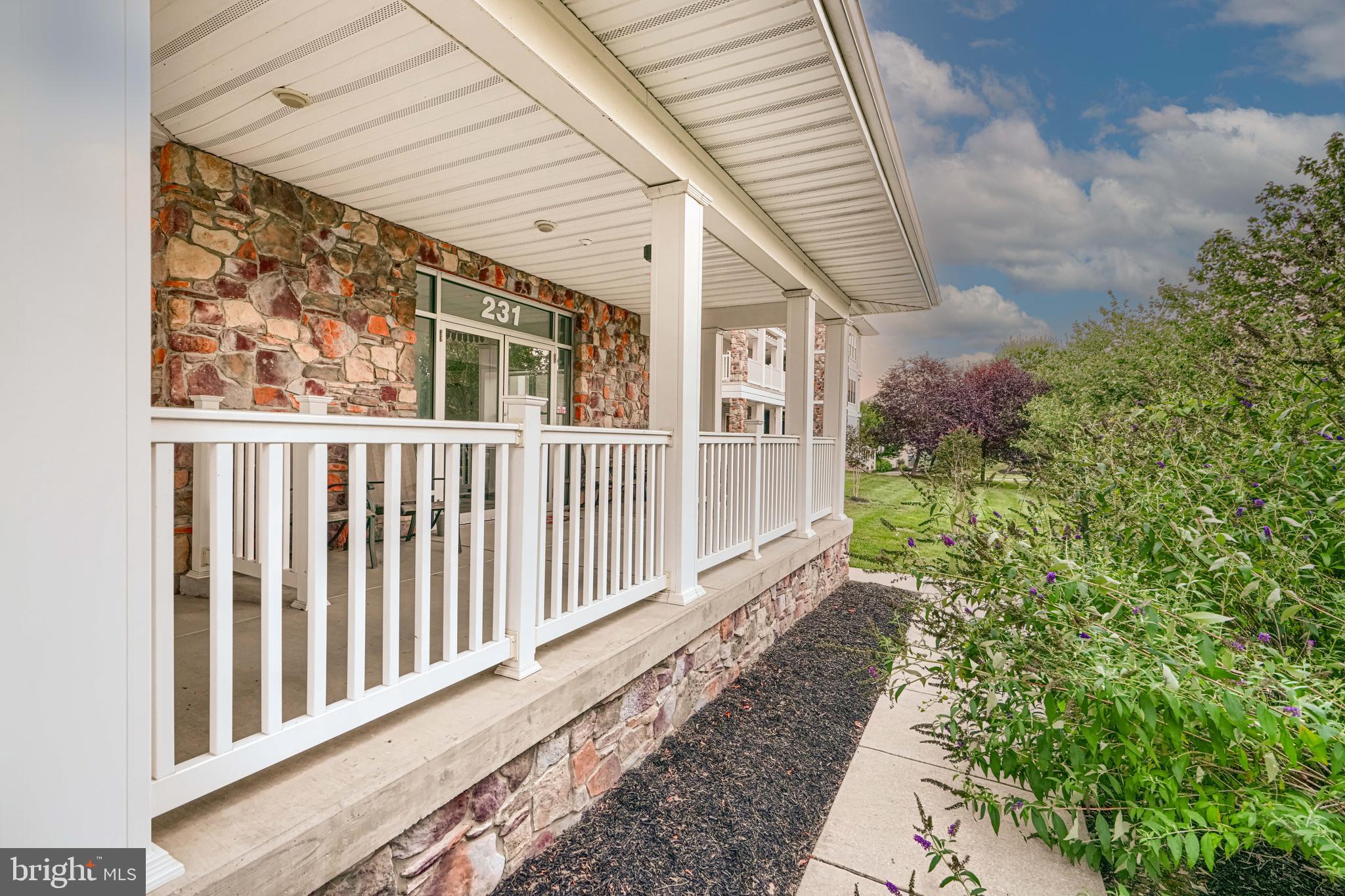 231 Roundhouse Drive, Unit 3E Perryville, MD 21903 - Photo 1 of 38 a view of a house with a small yard and wooden floor and fence