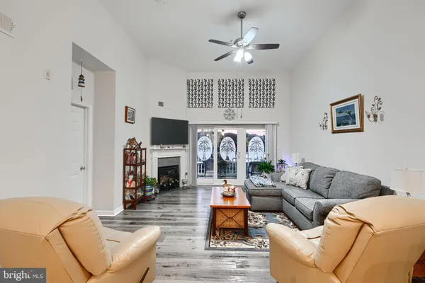 a living room with fireplace furniture and a flat screen tv