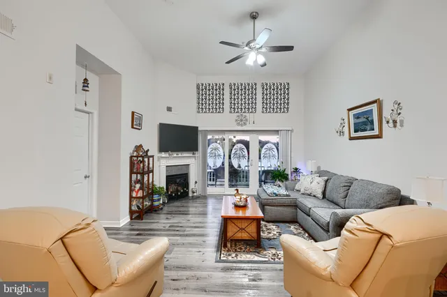 a living room with fireplace furniture and a flat screen tv