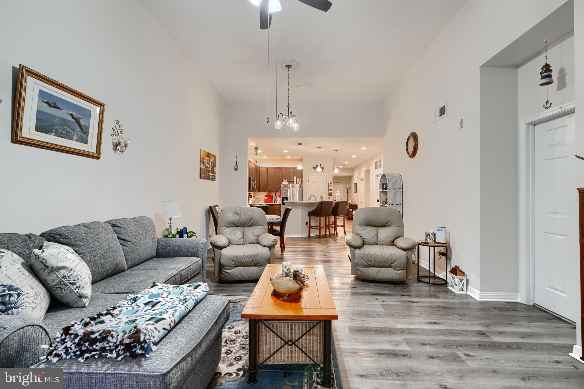 231 Roundhouse Drive, Unit 3E Perryville, MD 21903 - Photo 12 of 38 a living room with furniture ceiling fan and a rug