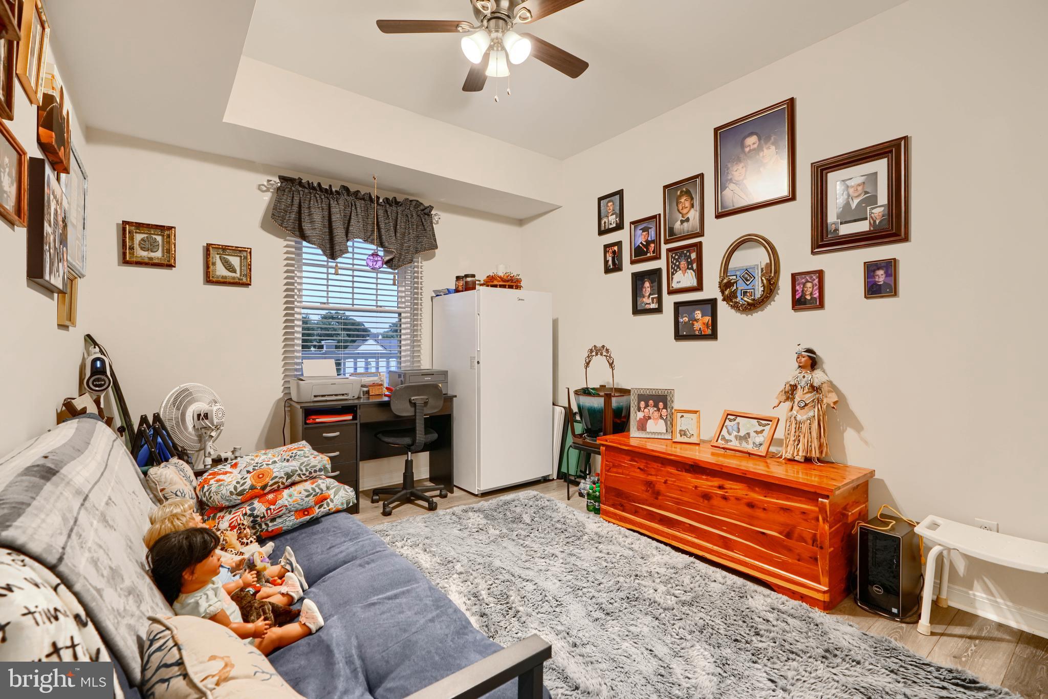 231 Roundhouse Drive, Unit 3E Perryville, MD 21903 - Photo 13 of 38 a living room with furniture and wooden floor