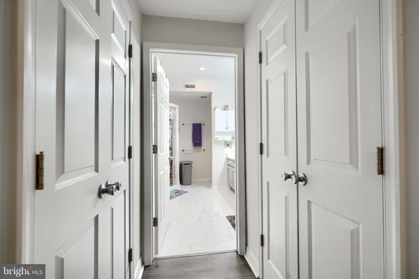 a view of a bathroom from a hallway