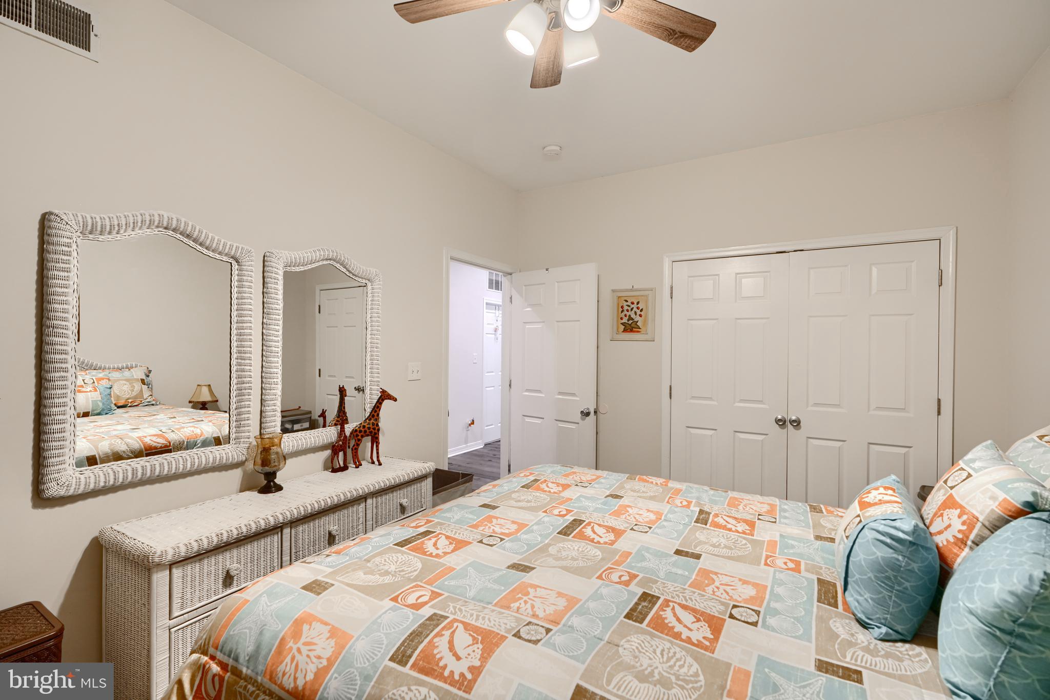 231 Roundhouse Drive, Unit 3E Perryville, MD 21903 - Photo 28 of 38 a bedroom with a bed and a chandelier