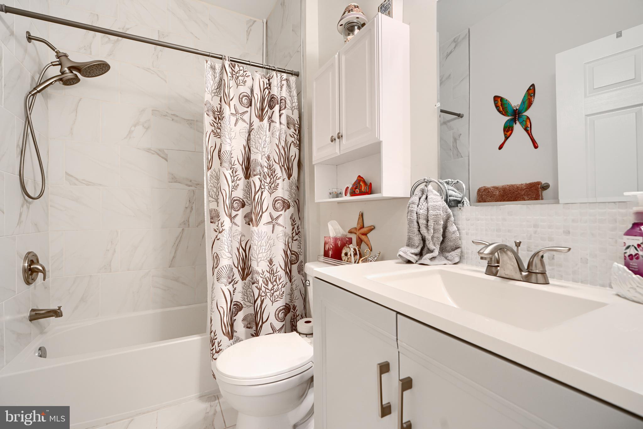 231 Roundhouse Drive, Unit 3E Perryville, MD 21903 - Photo 31 of 38 a bathroom with a sink a toilet and a bathtub