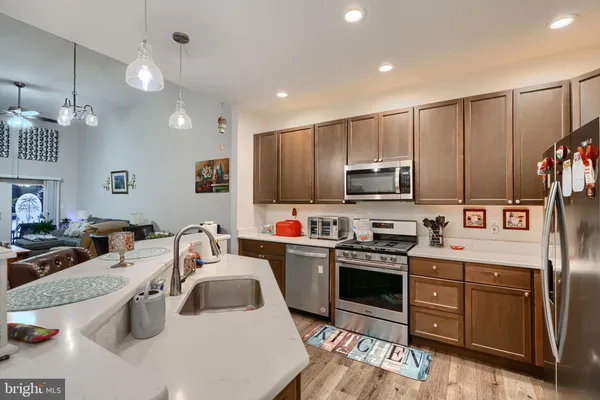 a kitchen that has a sink and cabinets