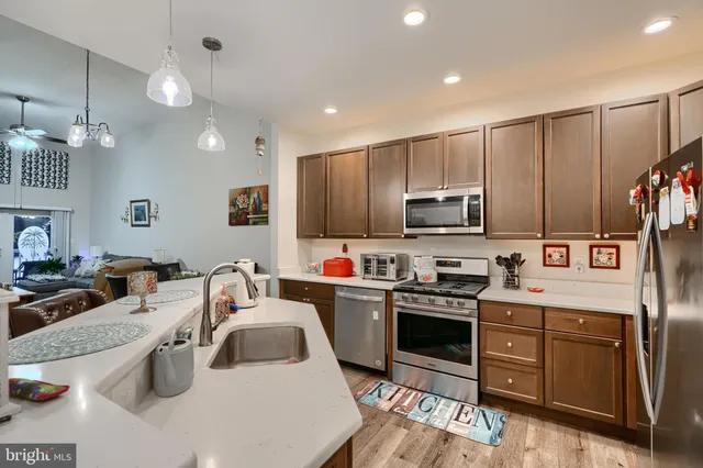 a kitchen that has a sink and cabinets