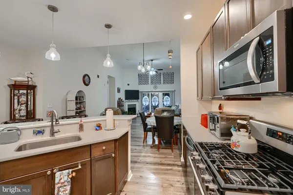 a kitchen with a sink stove and cabinets