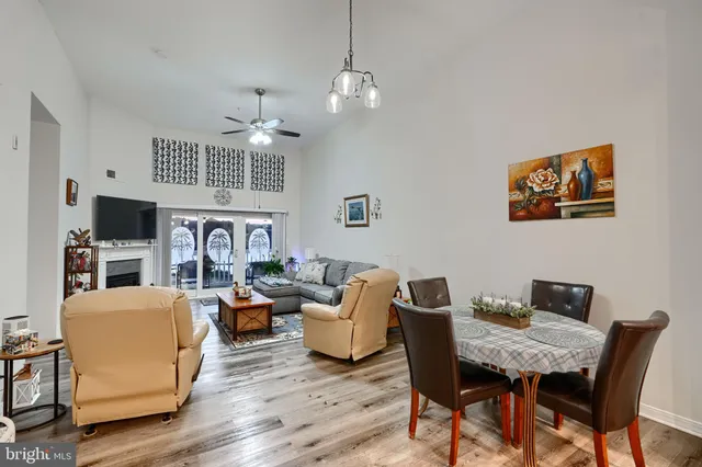 a living room with fireplace furniture and a flat screen tv