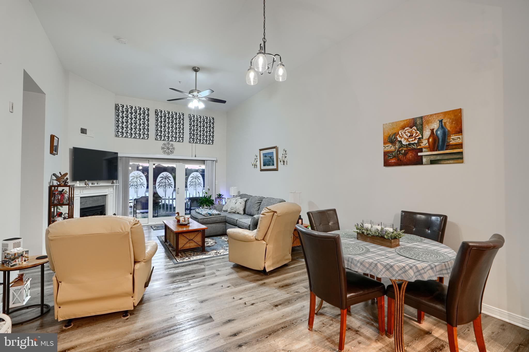 231 Roundhouse Drive, Unit 3E Perryville, MD 21903 - Photo 9 of 38 a living room with fireplace furniture and a flat screen tv