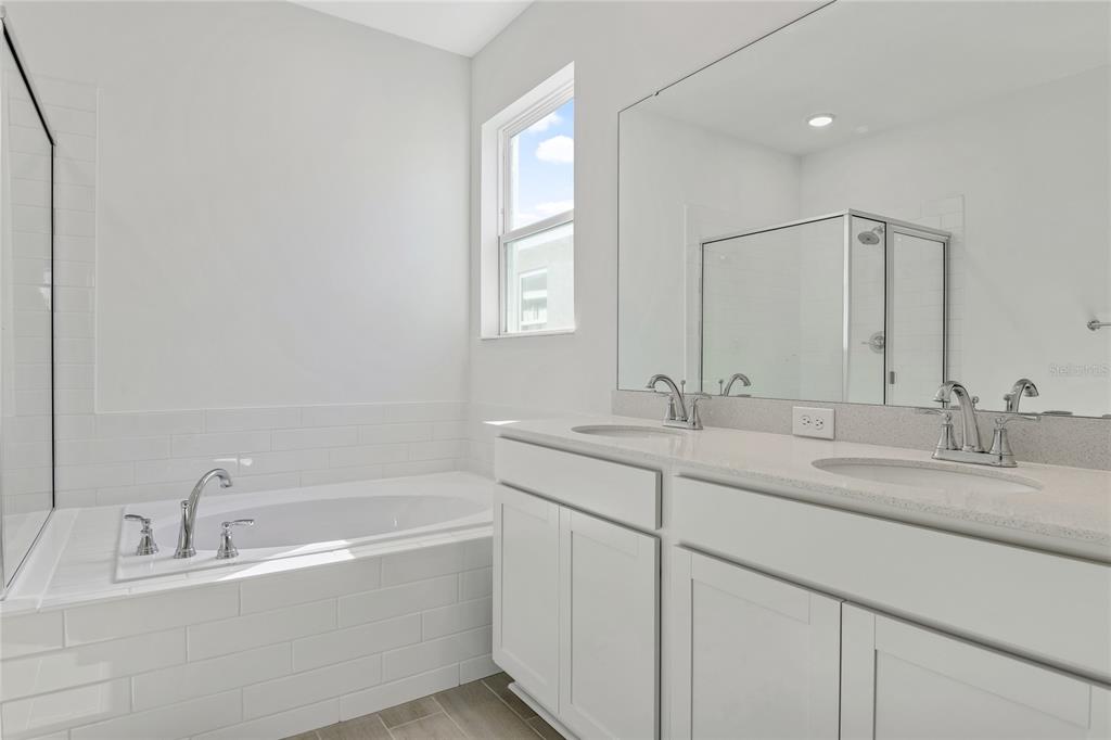 5347 Mickey Avenue Lake Wales, FL 33859 - Photo 13 of 18 a bathroom with a tub sink and mirror