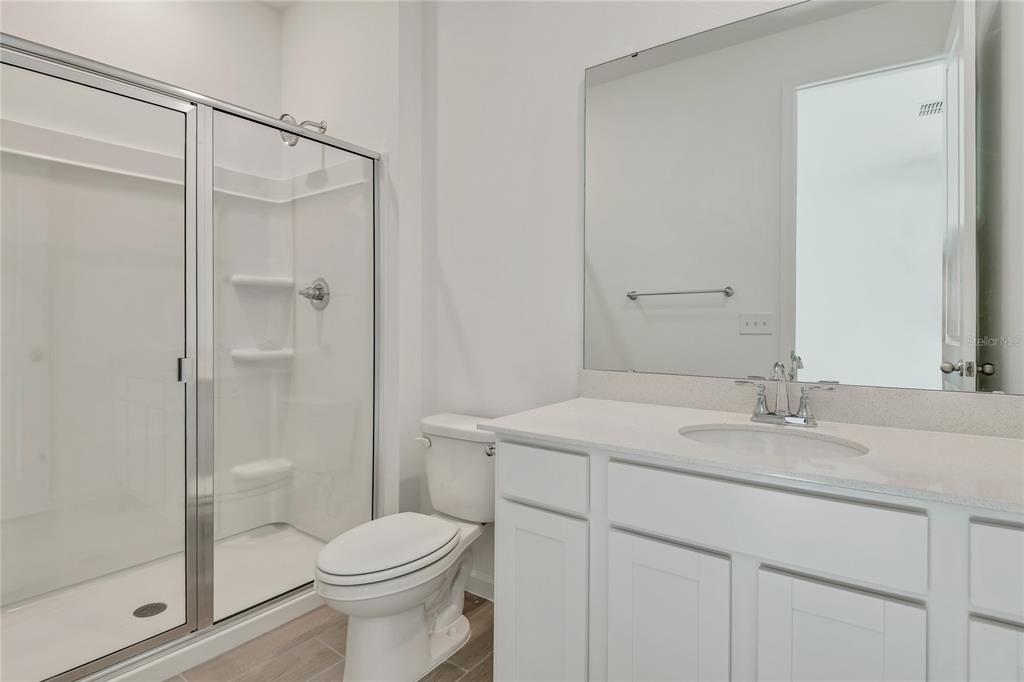 5347 Mickey Avenue Lake Wales, FL 33859 - Photo 15 of 18 a bathroom with a sink toilet and shower