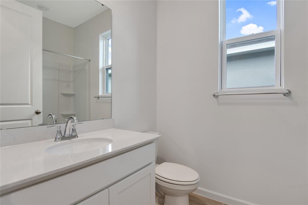 5347 Mickey Avenue Lake Wales, FL 33859 - Photo 4 of 18 a bathroom with a sink toilet and a mirror